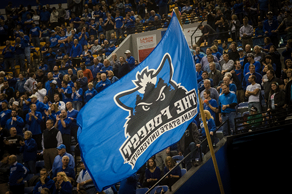 A large flag of the student section, The Forest, waves in front of the stands during a basketball game in Hulman Center.